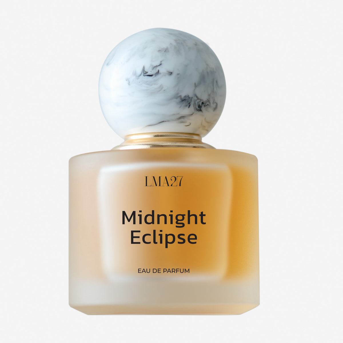Perfume bottle labeled 'Midnight Eclipse' by LMAZ on a light background